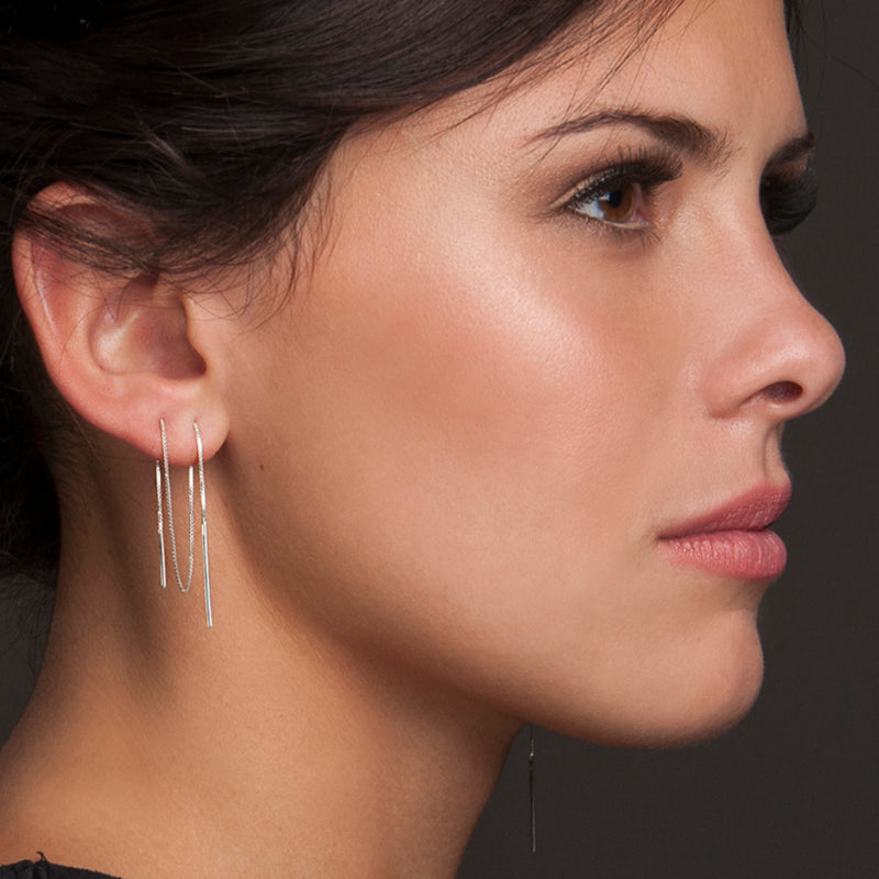 Customer Favorites from Haley Lebeuf. Model is wearing the FEMME Versatile Threader in Sterling Silver. It is threaded through multiple piercings and can be worn multiple ways. We love versatile jewelry and thoughtfully design pieces for you to enjoy.