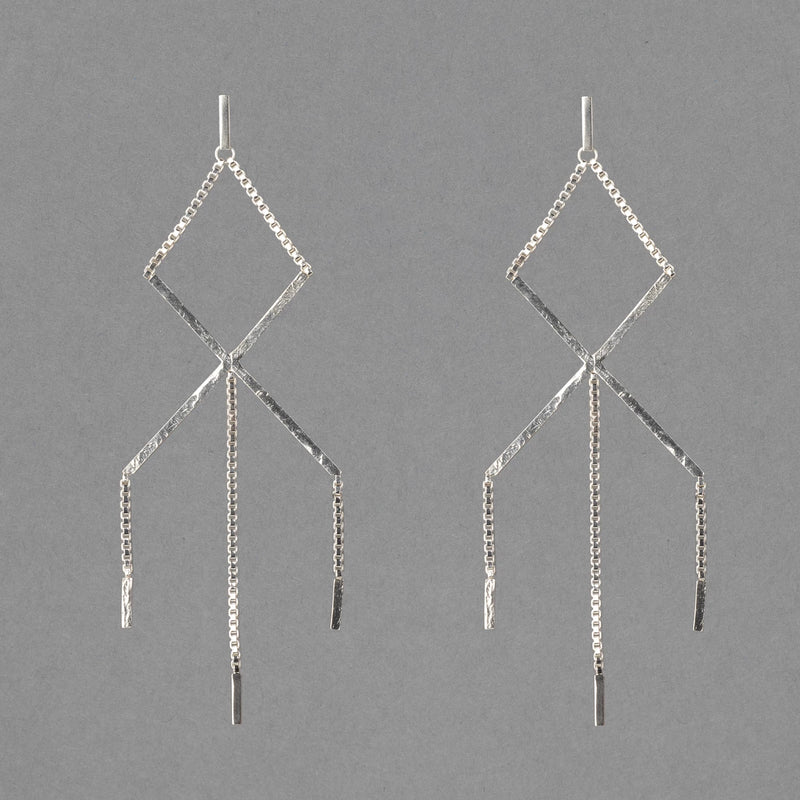 sterling silver shoal creek earring by austin texas based jeweler haley lebeuf. this modern bohemian earring has box chain and a lot of  texture